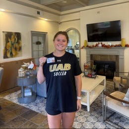 woman holding a badge